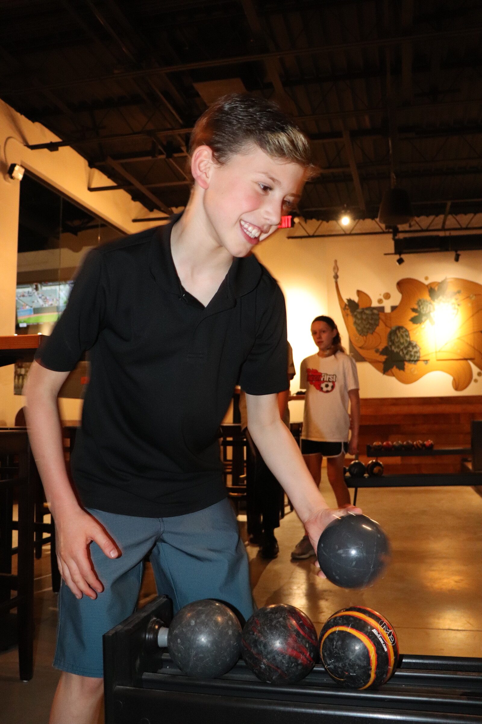A child duckpin bowling