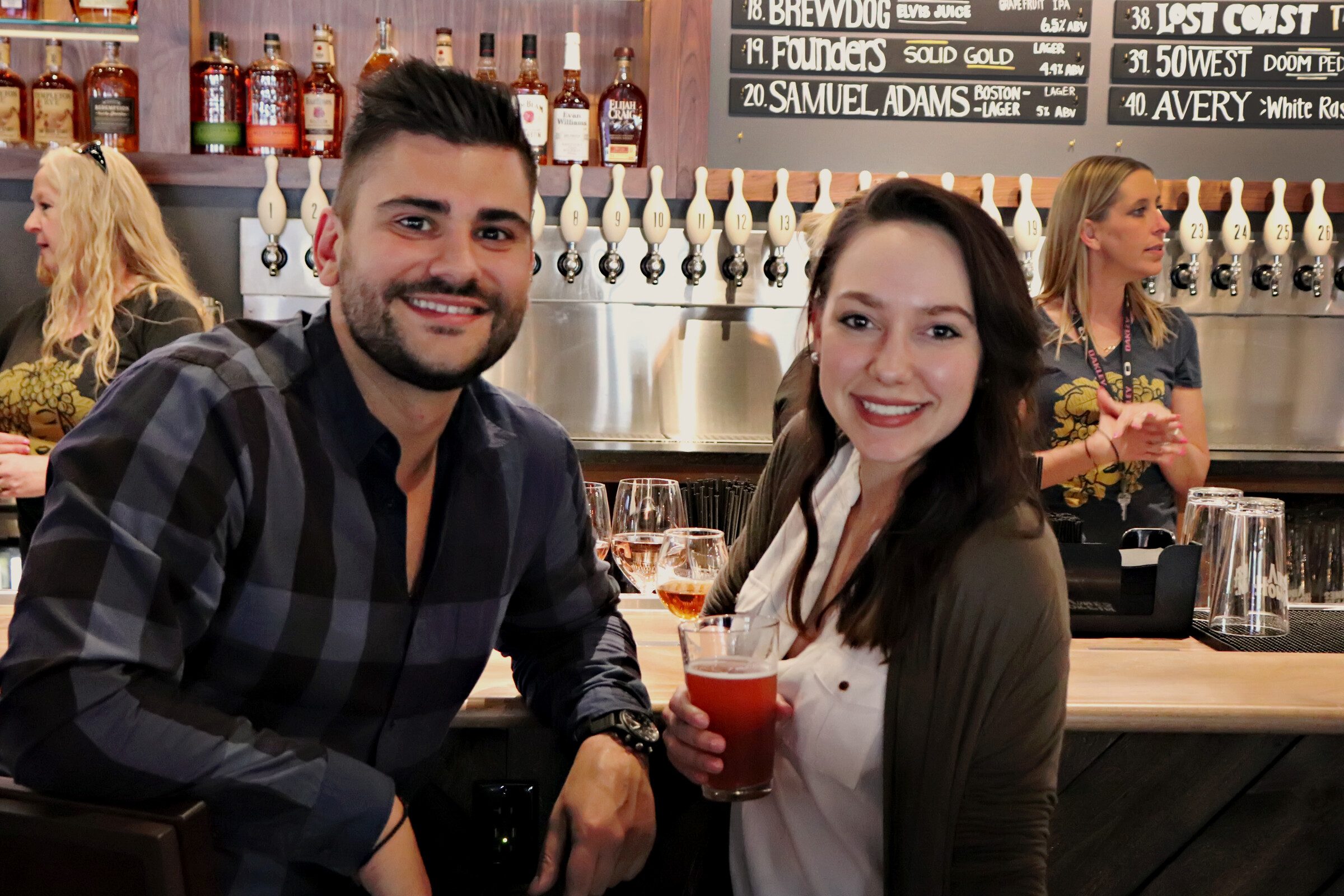 Guests enjoying drinks at the bar