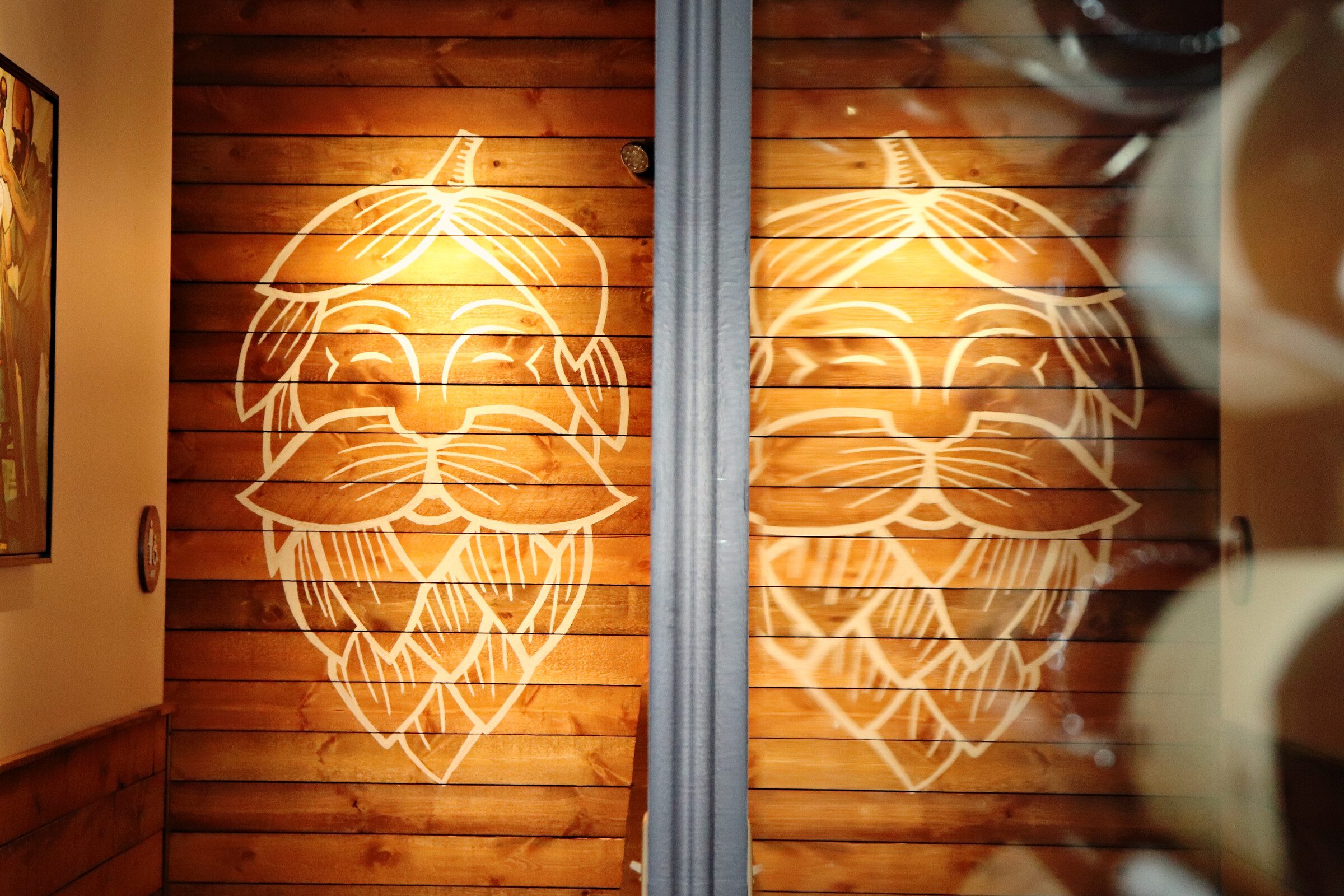 Hoppin' Vines logo painted on the wall