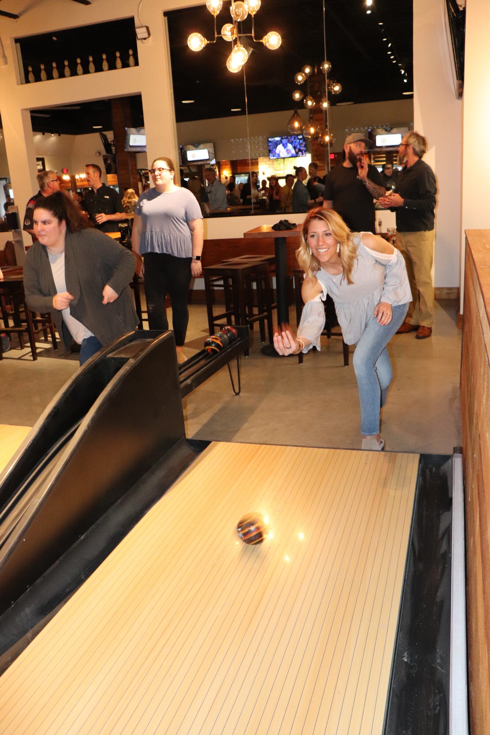 Patrons having a blast duckpin bowling