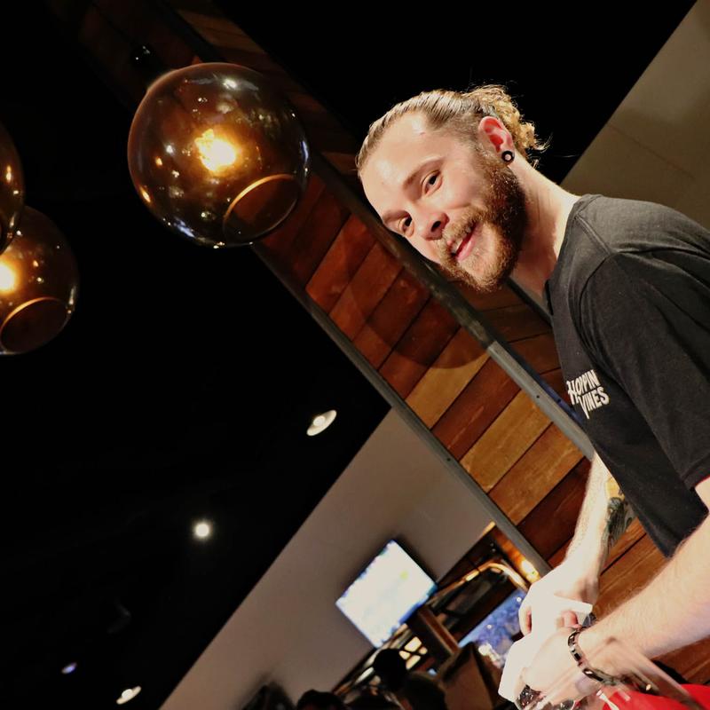 Bartender preparing drinks at Hoppin' Vines