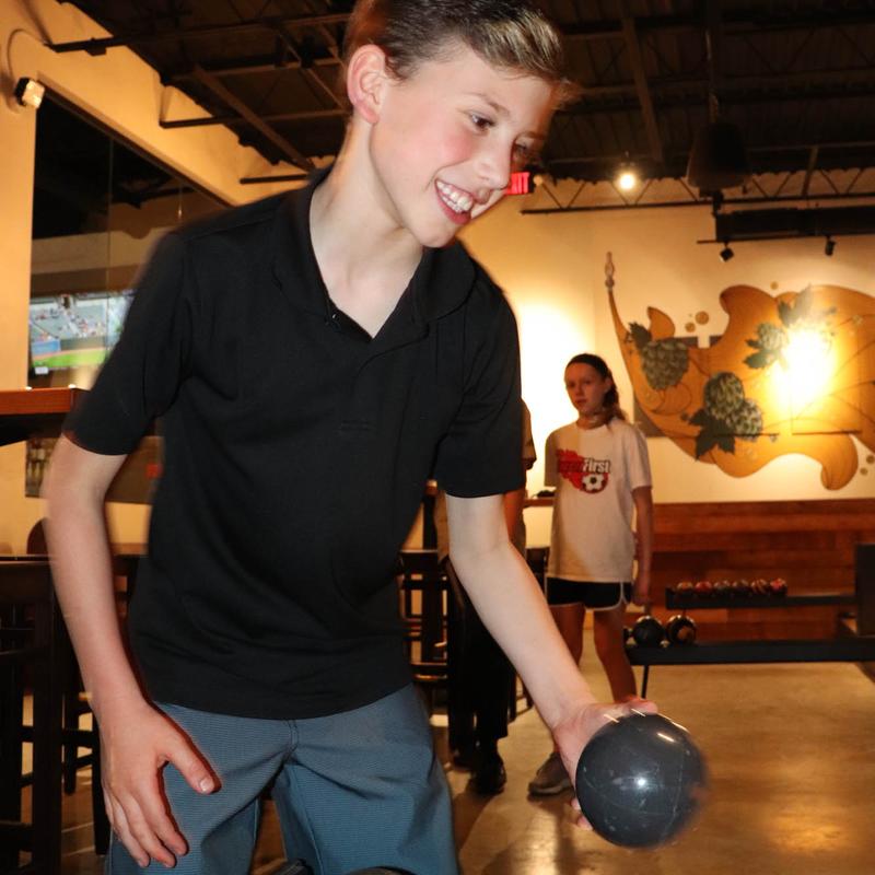 A child duckpin bowling