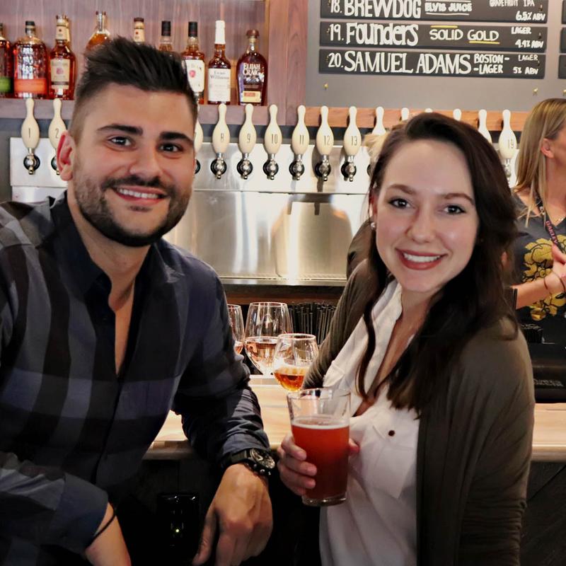Guests enjoying drinks at the bar