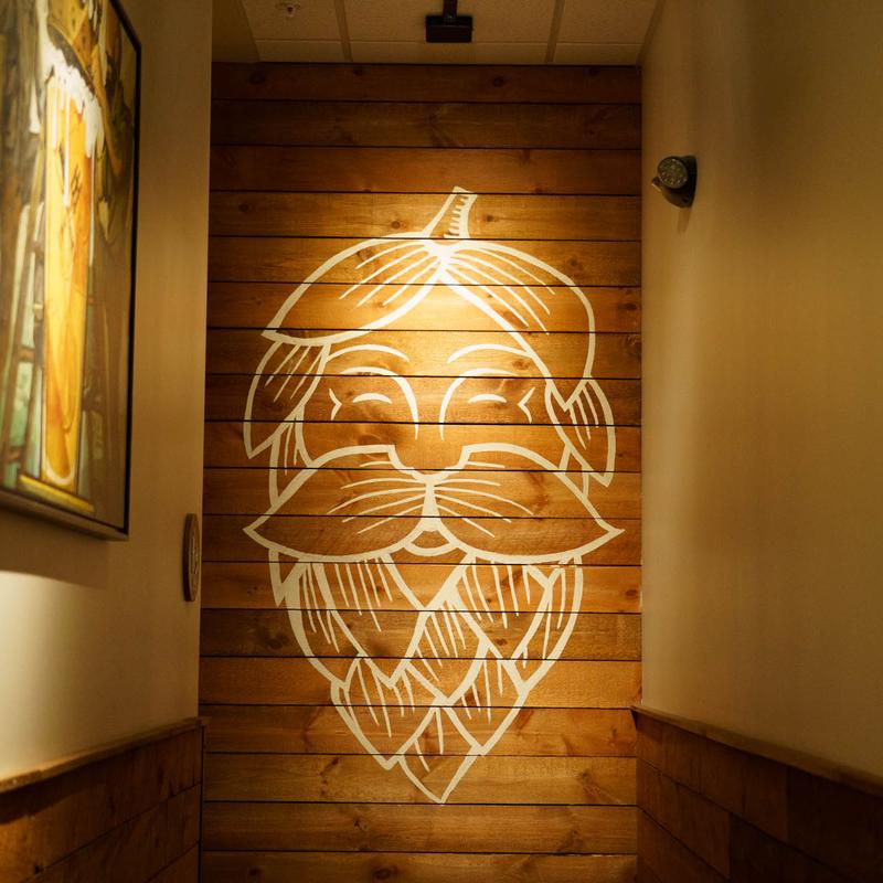 Hoppin' Vines logo painted on the wall